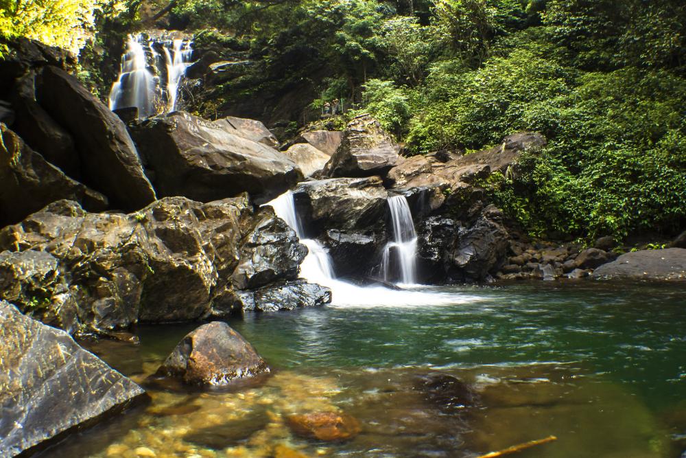 A pristine waterfall nestled in the Kudremukh region, accessible via a scenic trek.