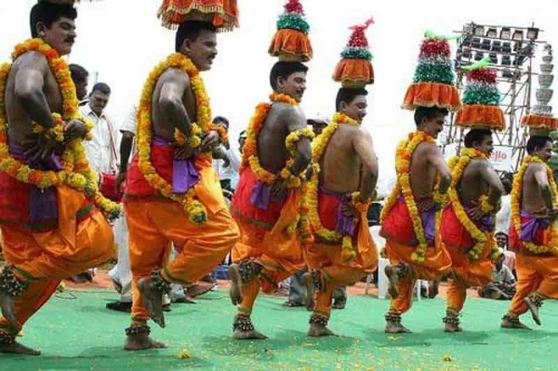 A folk dance balancing pots on the head, accompanied by Parai, Nadaswaram, and Thavil.