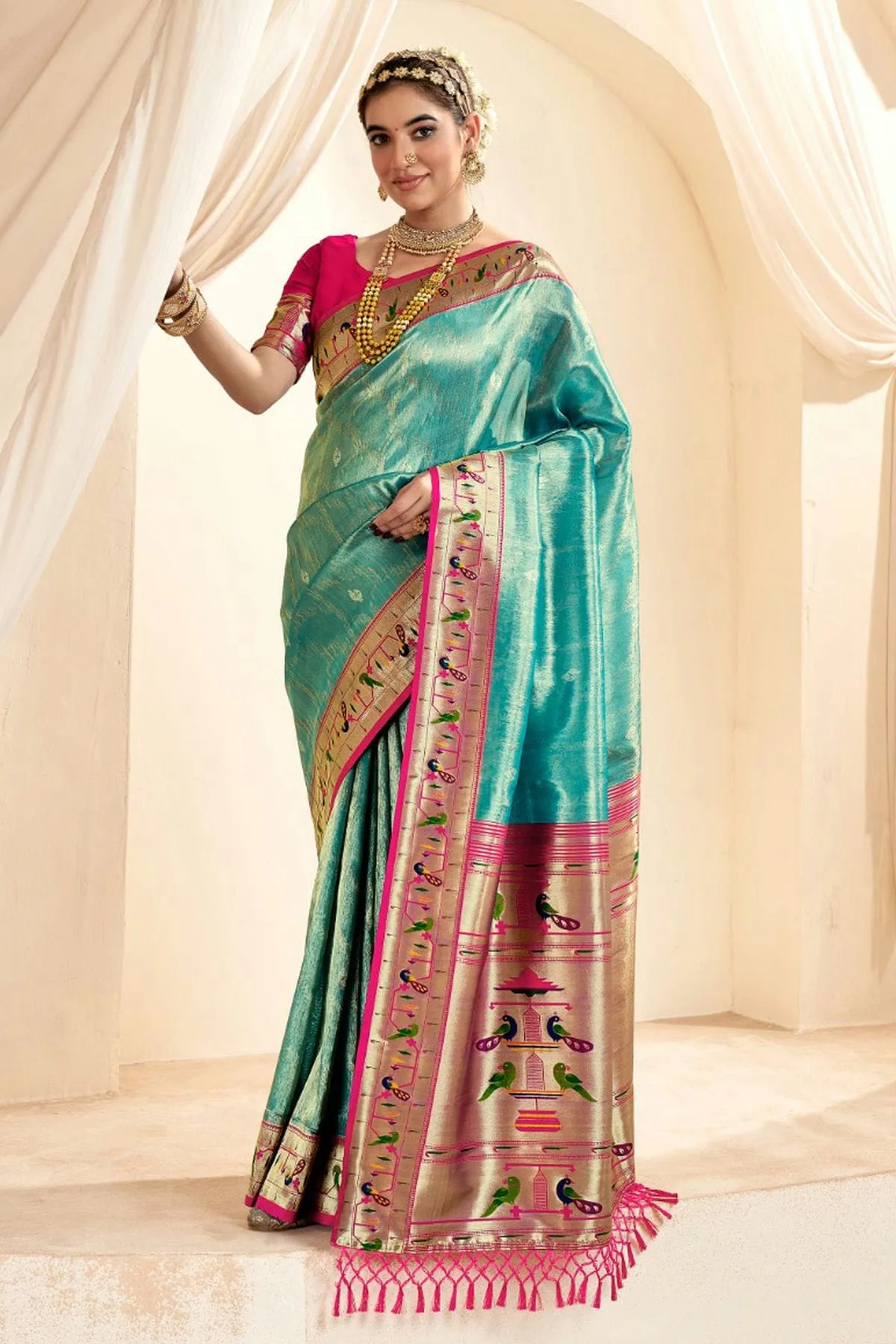 Exquisite silk sarees with intricate zari work, famous in Paithan.