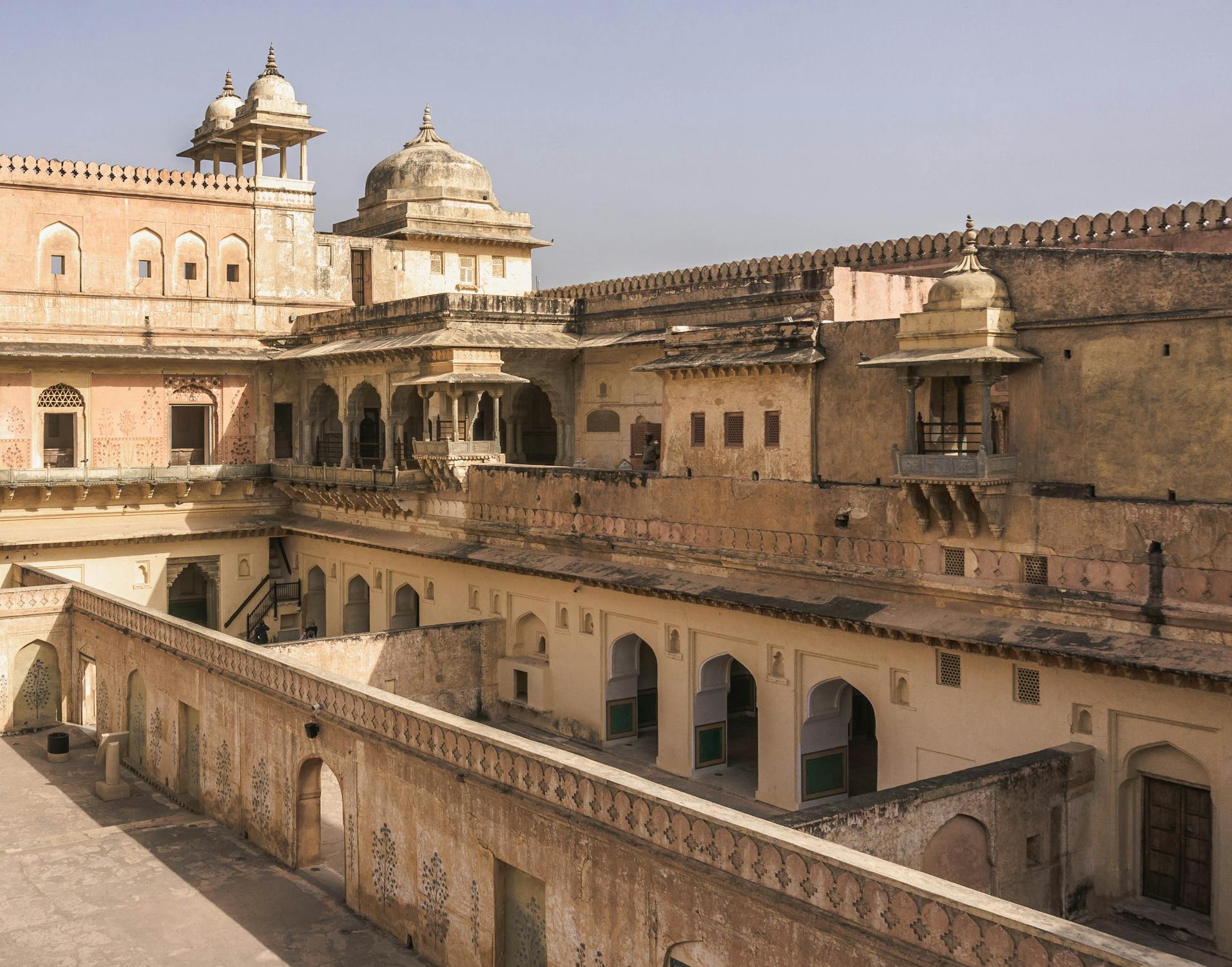 A majestic fort built in red sandstone and marble, offering panoramic views of the Aravalli hills.