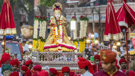 Gangaur Teej Festival - Rajasthani women in colorful attire carrying deity idols