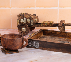 Artisan carving wooden handicrafts at Dilli Haat, Delhi – vibrant open-air market showcasing India’s traditional crafts.