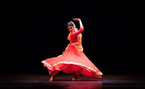 Kathak dancer in Delhi spinning in traditional lehenga-choli, showcasing Mughal-era footwork and expressions.