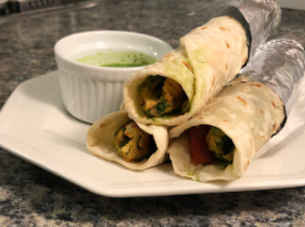Mughlai seekh kebabs and rumali rolls at Karim’s Delhi - juicy grilled meat with mint chutney.