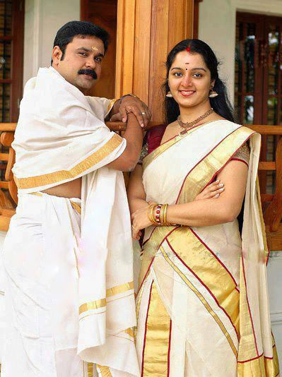 A traditional dhoti draped in a five-fold style, often paired with a white or golden-bordered angavastram.