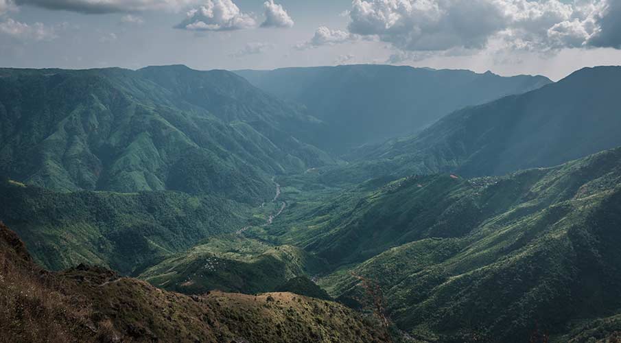 Laitlum Canyon viewpoint - dramatic misty gorges and endless hills in Meghalaya.