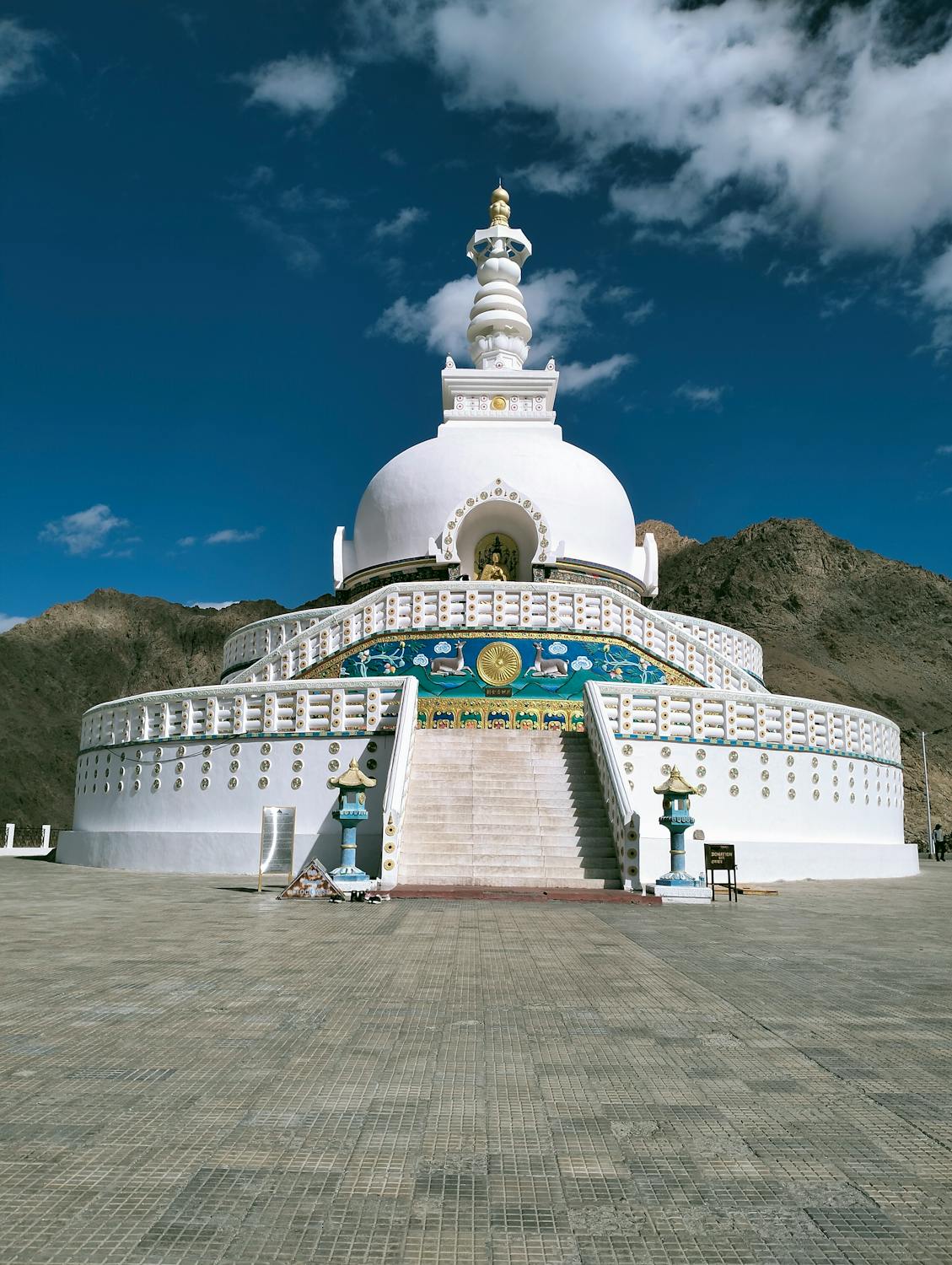 A white-domed Buddhist monument offering breathtaking views of Leh and its mountains.