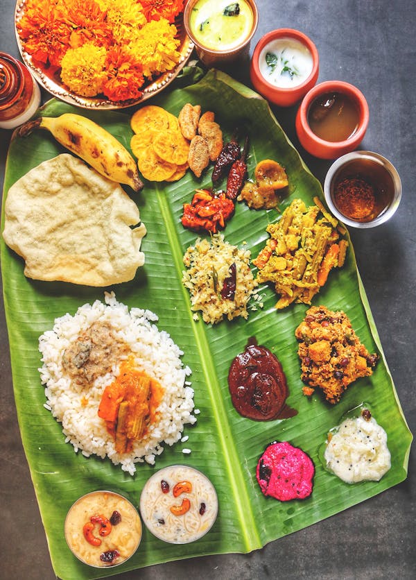 Dominated by rice, coconut, and spices, with dosa, idli, vada, and sambar as staples.