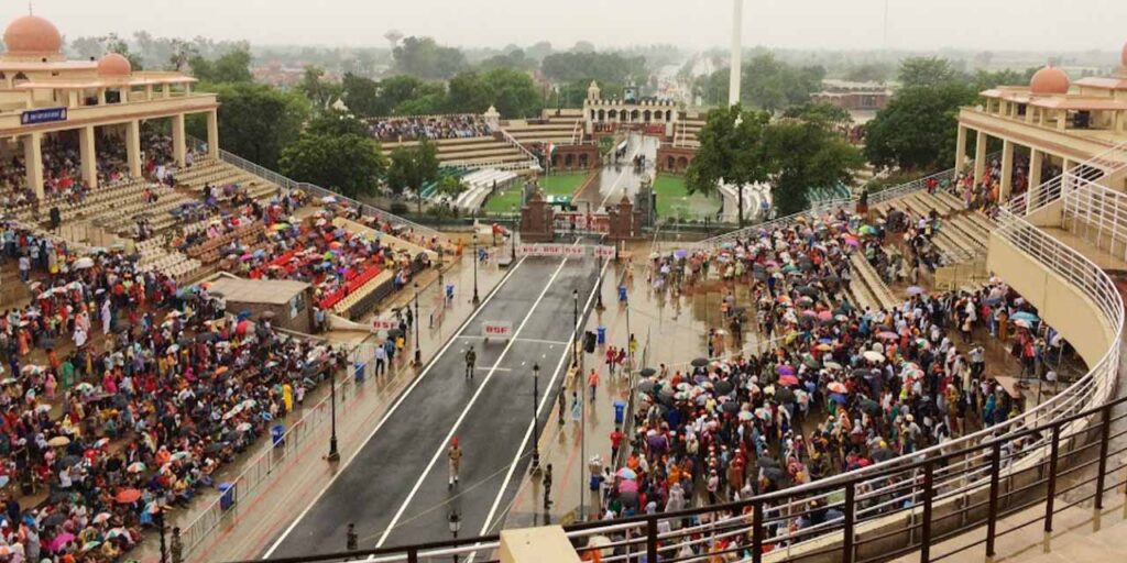 Experience patriotic energy as India and Pakistan perform a spirited flag-lowering ceremony at the daily border parade.