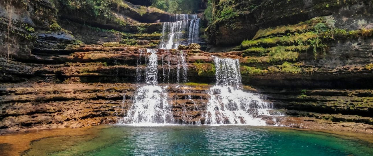 Three-tiered Wei Sawdong Falls - emerald cascades in East Khasi Hills, Meghalaya.