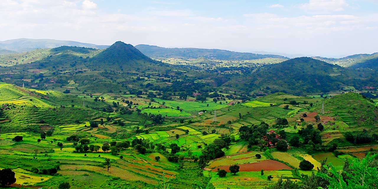 Scenic view of Araku Valley in Andhra Pradesh surrounded by hills.