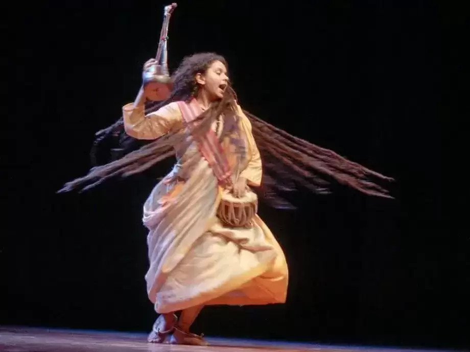 Chhau dancers in vibrant masks performing a traditional folk dance