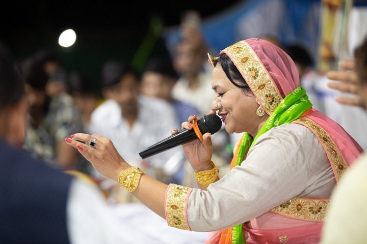 Devotional bhajans being sung in a traditional Mysuru temple.