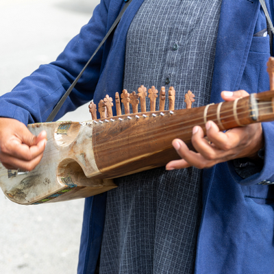 Henz singer using traditional Kashmiri instruments in Jammu & Kashmir.