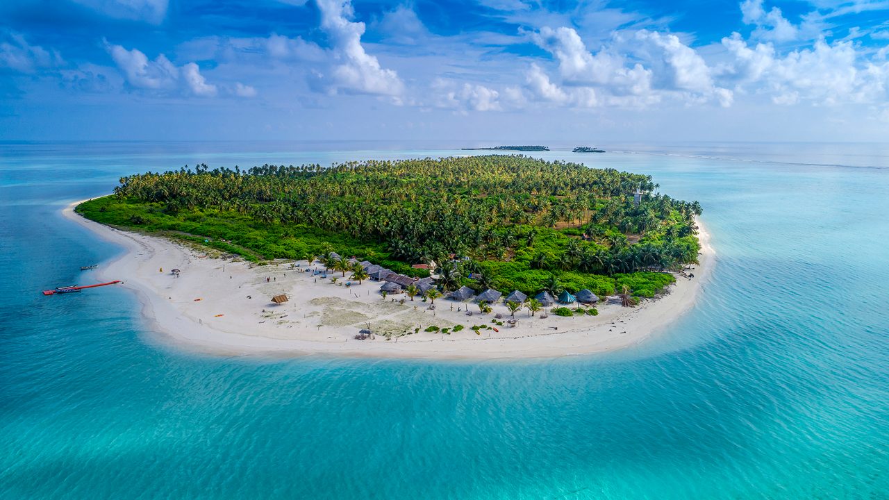 Kavaratti Island in Lakshadweep with mosques and turquoise sea backdrop.