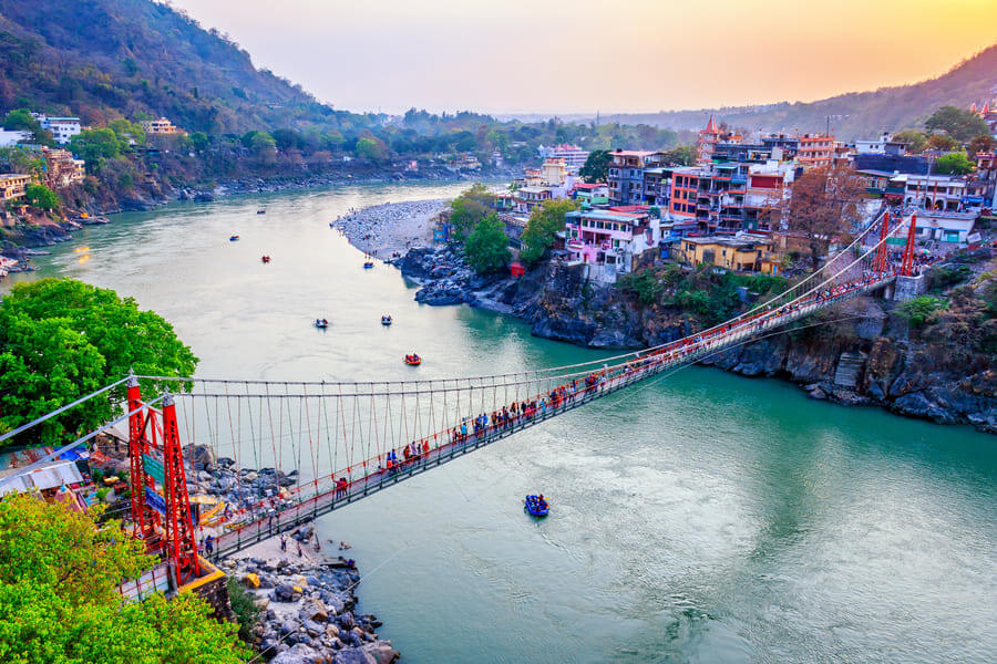 Experience the iconic suspension bridge Lakshman Jhula in Rishikesh, a spiritual landmark with breathtaking Ganges views.