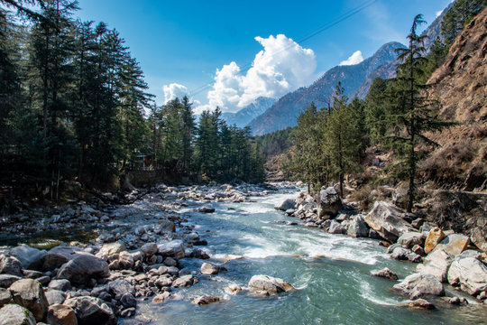Snow-capped Himalayan peaks visible from the lush valleys of Manali in Himachal Pradesh