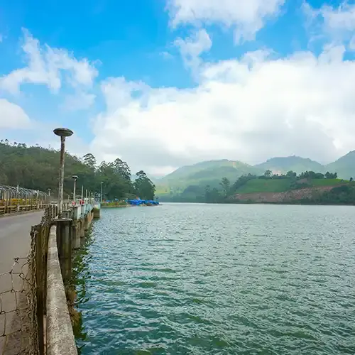 Scenic reservoir in Munnar surrounded by rolling hills.Scenic reservoir in Munnar surrounded by rolling hills.