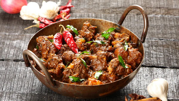 Spicy Goan Pork Vindaloo – a fiery curry with Portuguese influence, slow-cooked with vinegar, garlic, and Kashmiri chilies.