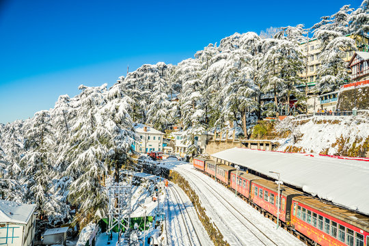 Colonial architecture and scenic mountain views along Shimla's Mall Road in Himachal Pradesh