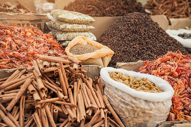 Vibrant spice market in Kochi with fresh cardamom, pepper, and cloves.