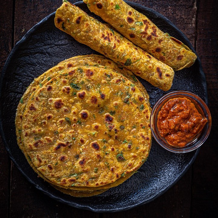 Thin, spiced Theplas served with chutney in Gujarat.