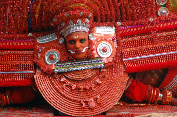 Colorful Theyyam ritual performance, a vibrant traditional art form near Kochi.