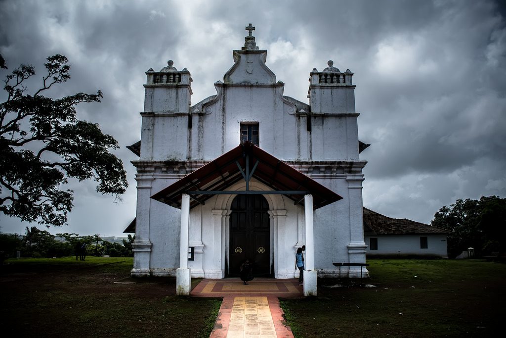 The Three Kings' Church in Cansaulim, Goa – A charming 16th-century hilltop chapel with whitewashed Portuguese architecture, offering panoramic views of the Arabian Sea.