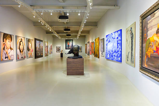 Intricate Kerala mural paintings and Kathakali masks exhibited at a heritage art gallery in Fort Kochi.