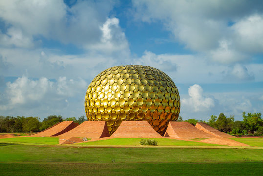 The iconic Matrimandir golden dome in Auroville near Puducherry, symbolizing human unity.