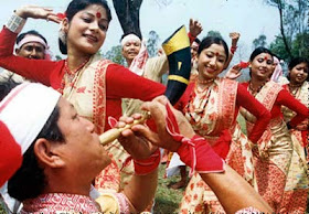 Folk artists performing Bihu geet with traditional instruments