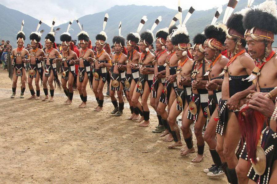 Warriors performing the Chang Lo dance in traditional Naga attire