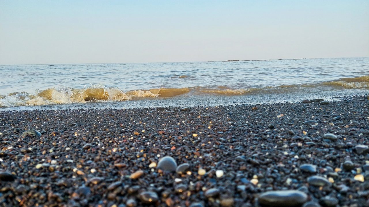 Devka Beach in Daman and Diu with rocky shoreline and sunset views