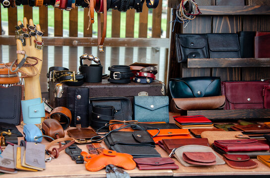 Bustling Kanpur leather market with jackets and goods.
