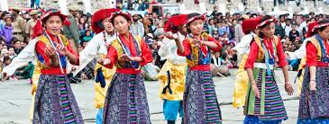 Women of Ladakh singing traditional wedding songs in vibrant attire.