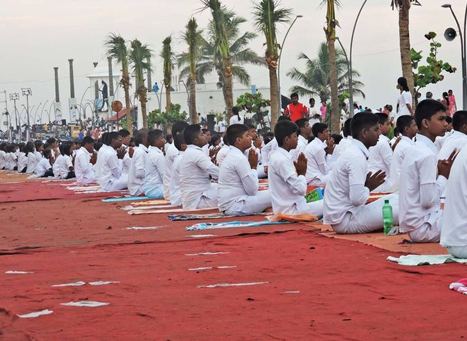 Yoga practitioners meditating during Puducherry’s International Yoga Festival at Auroville.