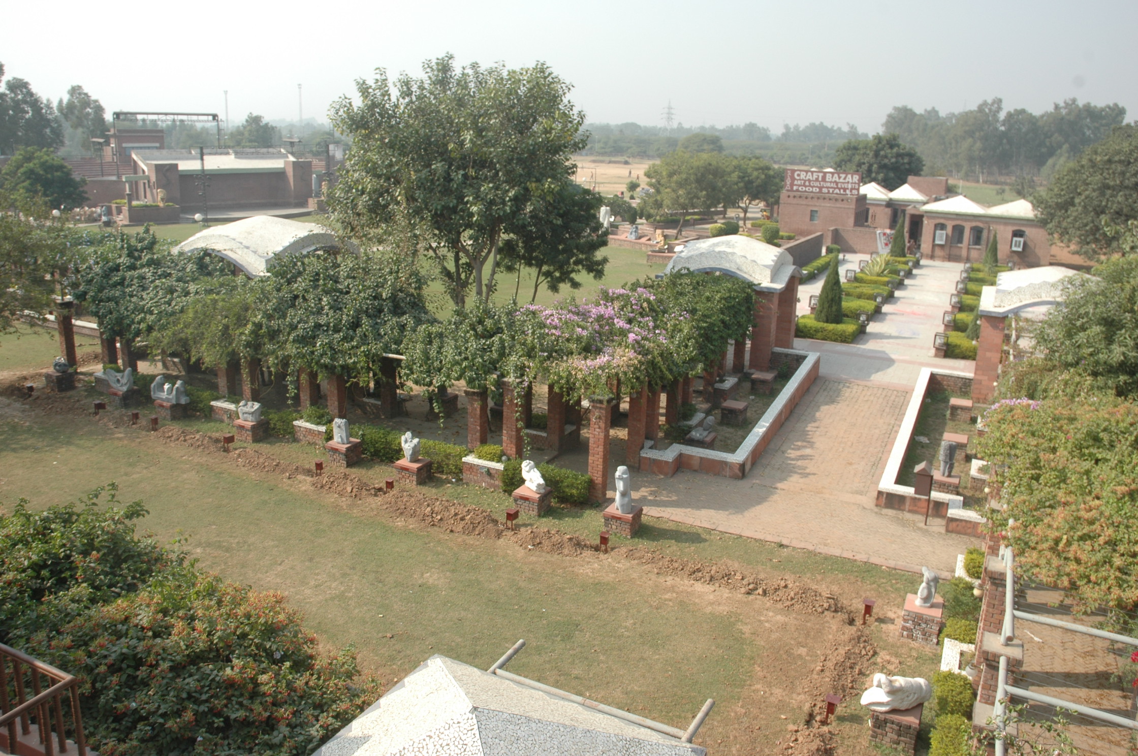 Kala Gram cultural village near Chandigarh showcasing crafts and folk performances Description: