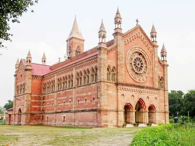 Gothic-style Kanpur Memorial Church with serene surroundings.