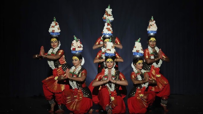 Traditional Karagattam folk dance in Puducherry with dancers balancing pots on heads.