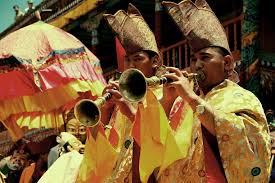 A Buddhist monk performing Lama Mani songs in Ladakh during a spiritual gathering.