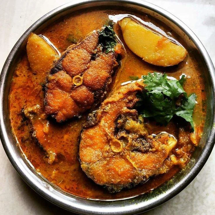 angy Assamese masor tenga fish curry with tomatoes and lemon