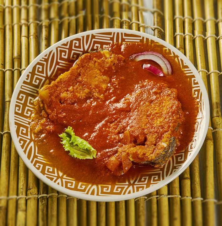 Tripura's traditional cuisine features fermented fish and bamboo shoot dishes.