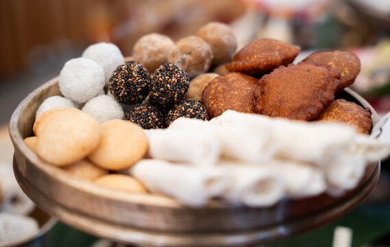 Traditional Assamese pitha - sweet and savory rice cakes
