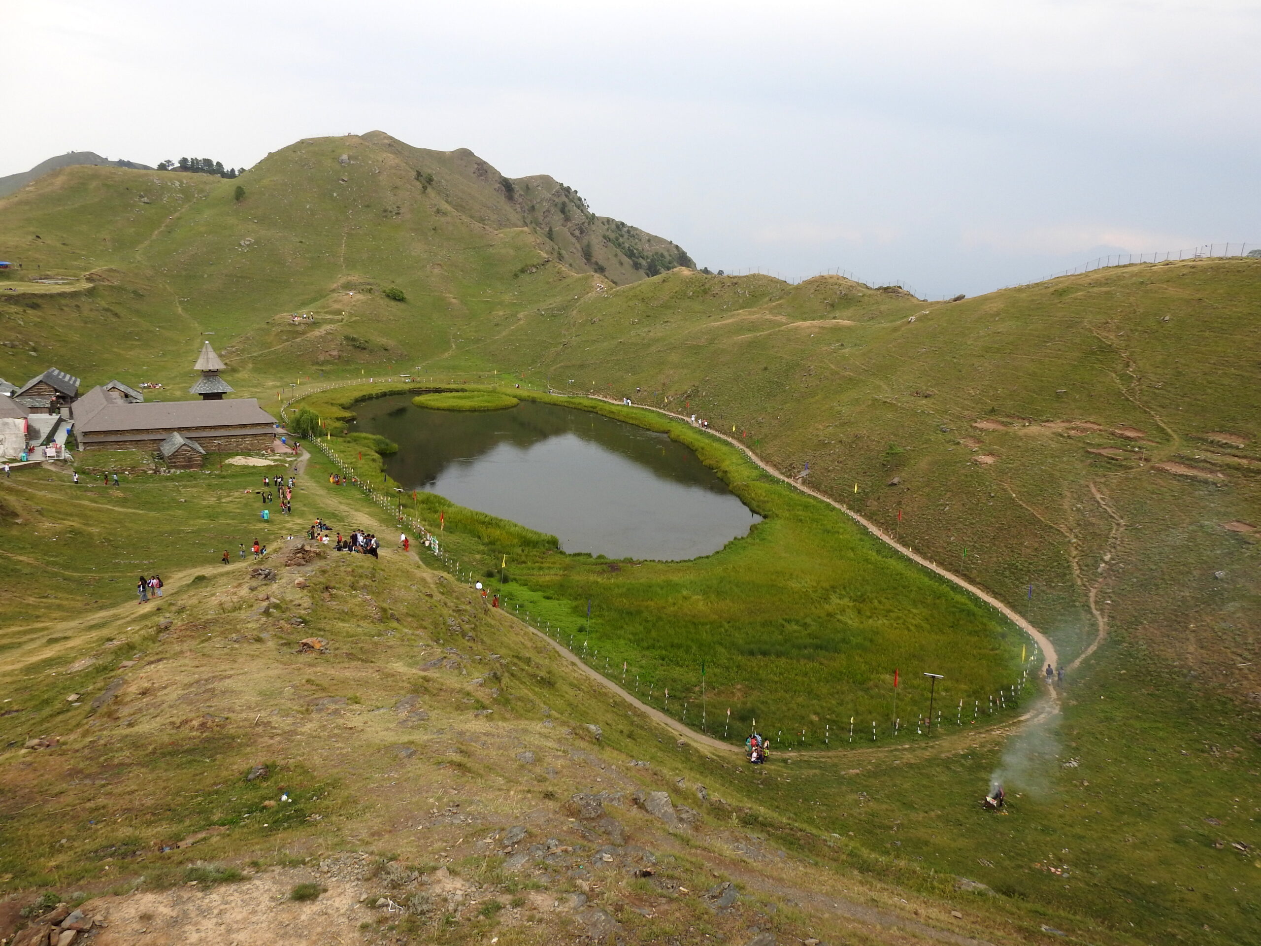 Prashar Lake with its floating temple and reflection on calm waters in Himachal Pradesh