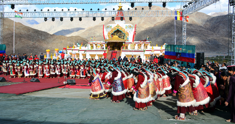 Ladakhi women performing the Shondol dance in traditional attire during a festive event.
