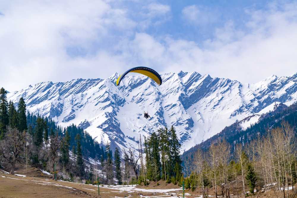 Paragliders soaring over Solang Valley near Manali, Himachal Pradesh