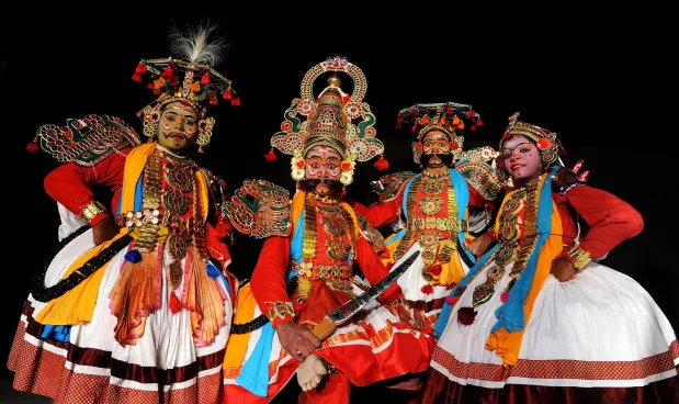 Vibrant Therukoothu street theater performance in Puducherry with elaborate costumes.
