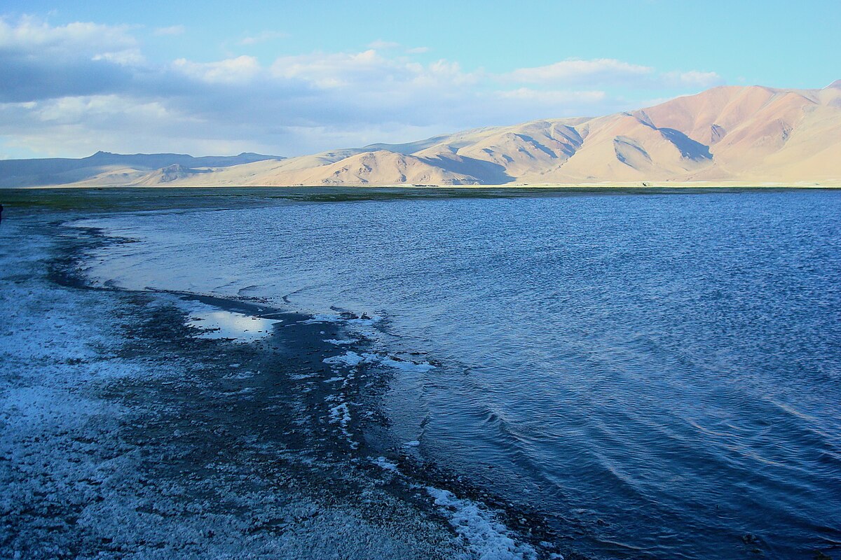 Tso Kar Lake surrounded by white salt flats in Ladakh.