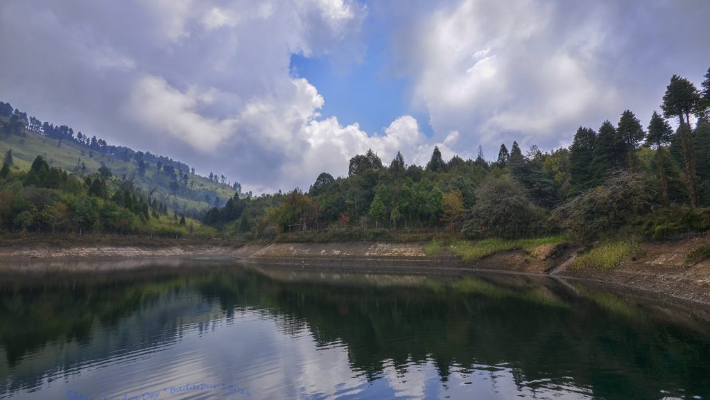 It is surrounded by lush forest and rolling hills.