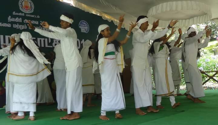 Badaga tribes performing folk music, a cultural treasure on Ooty City Page.